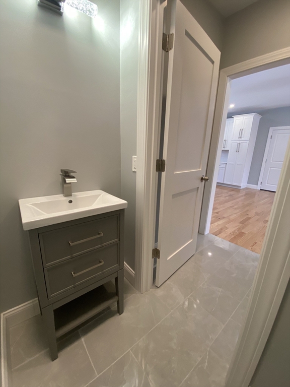 855 County Street, Unit 2 Attleboro, MA 02703 - Photo 9 of 27 a bathroom with a sink and a mirror