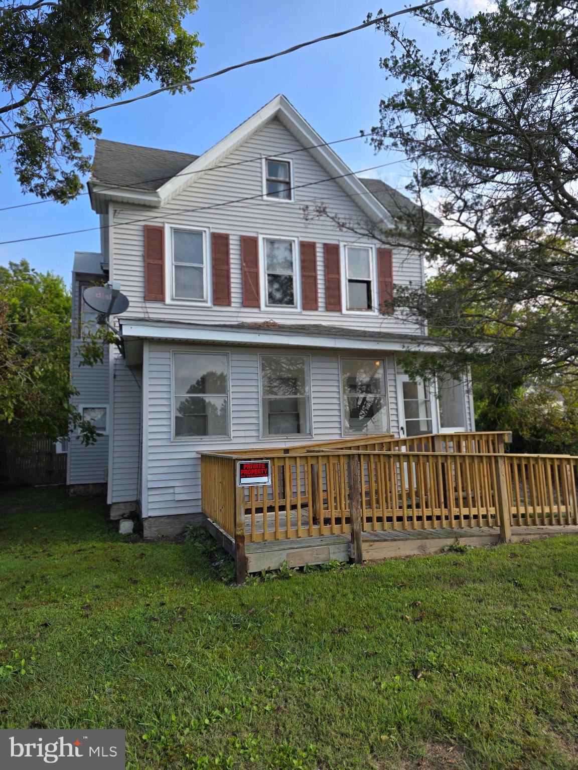 40 Maple Street Crisfield, MD 21817 - Photo 3 of 14 a front view of a house with garden