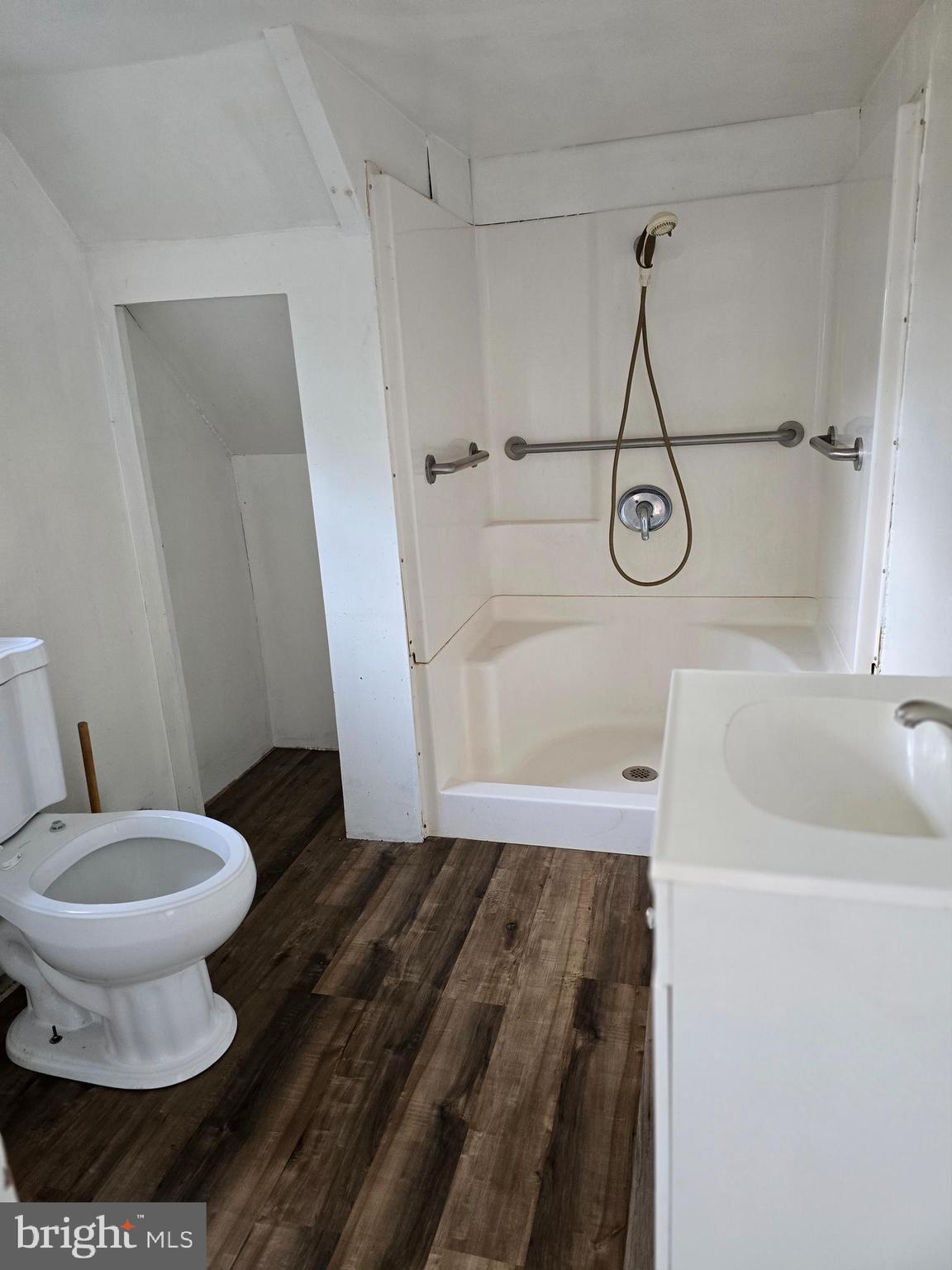 40 Maple Street Crisfield, MD 21817 - Photo 6 of 14 a bathroom with a toilet and a shower