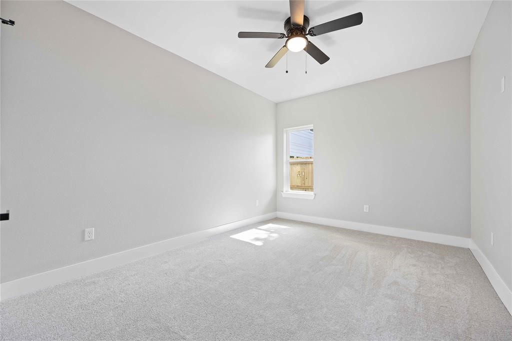 2118 Dan Street Houston, TX 77020 - Photo 14 of 35 an empty room with windows and fan