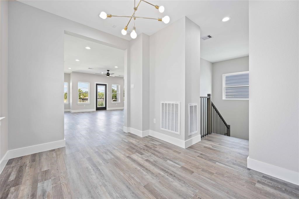 2118 Dan Street Houston, TX 77020 - Photo 23 of 35 an empty room with wooden floor and entrance