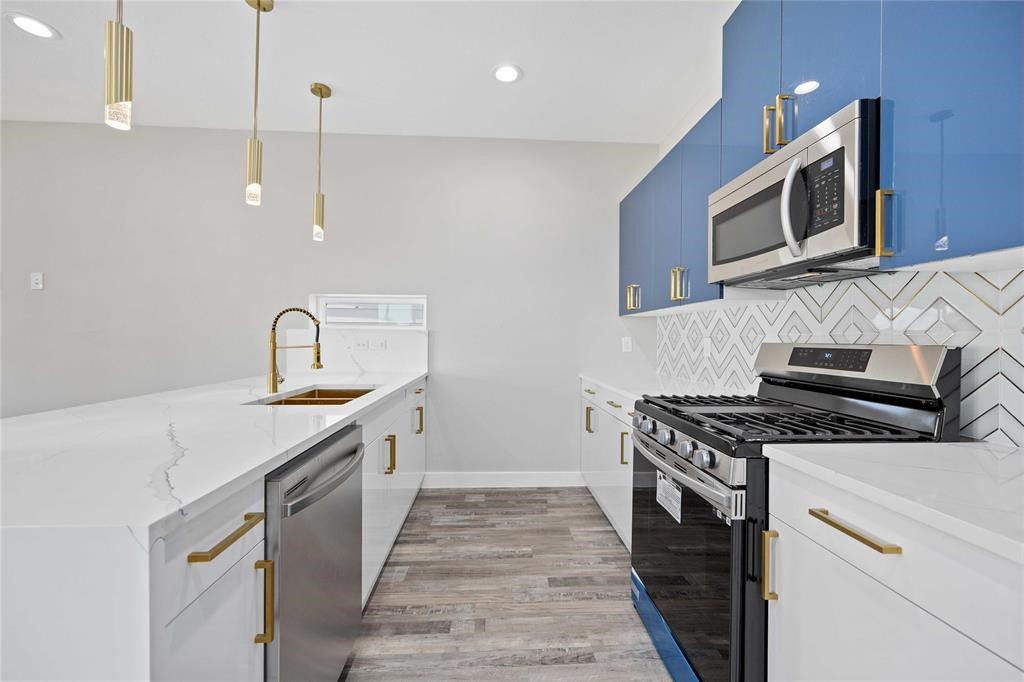 2118 Dan Street Houston, TX 77020 - Photo 27 of 35 a kitchen with stainless steel appliances granite countertop a stove a sink and a microwave