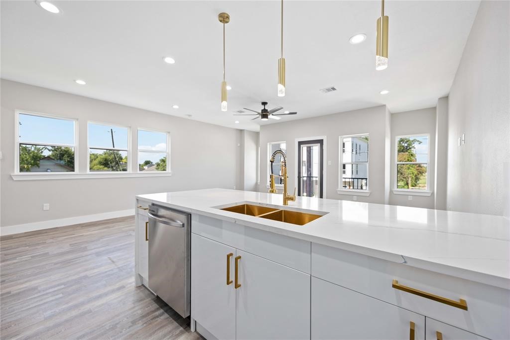 2118 Dan Street Houston, TX 77020 - Photo 28 of 35 a kitchen with stainless steel appliances granite countertop a sink a window and counter space
