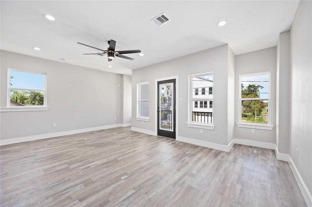 2118 Dan Street Houston, TX 77020 - Photo 30 of 35 a view of an empty room with a window and wooden floor