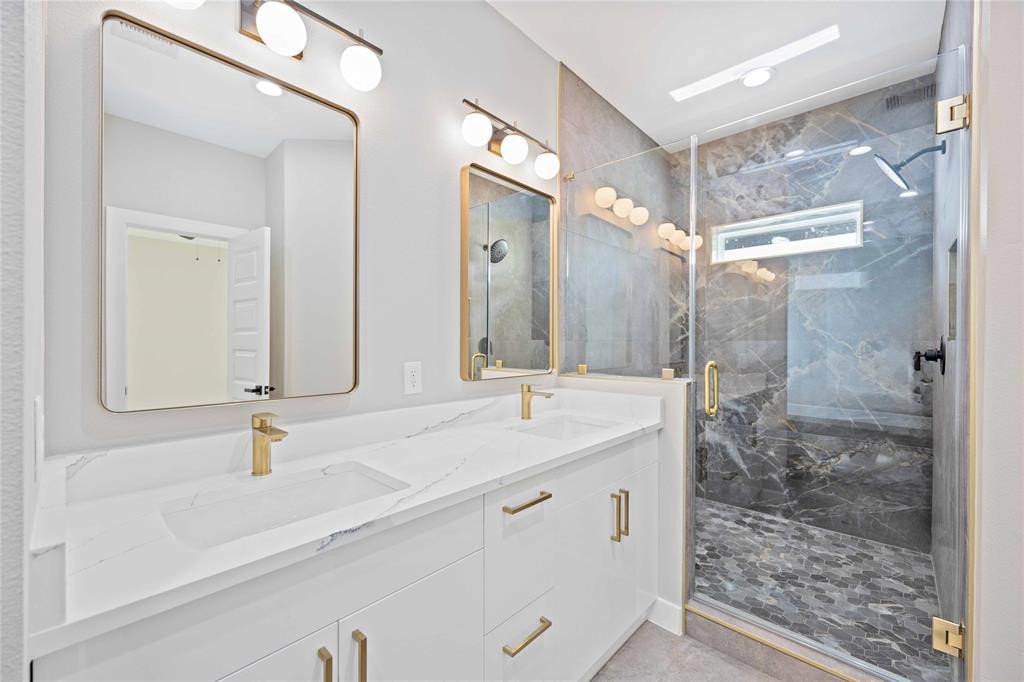 2118 Dan Street Houston, TX 77020 - Photo 34 of 35 a bathroom with double sink and a mirror