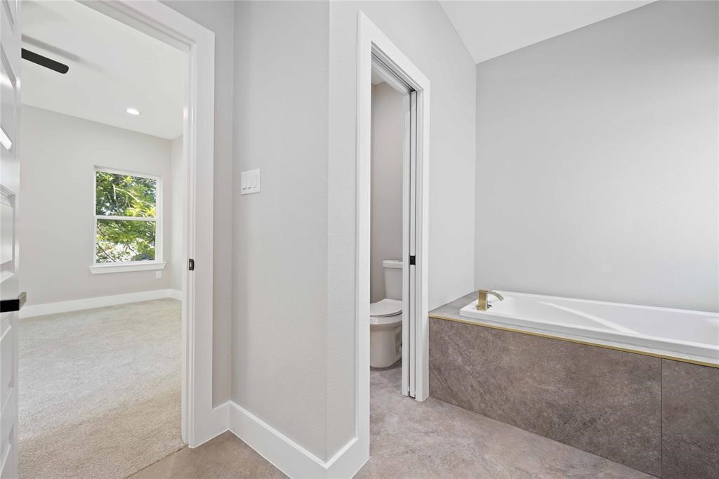 2118 Dan Street Houston, TX 77020 - Photo 35 of 35 a bathroom with a bathtub and a shower