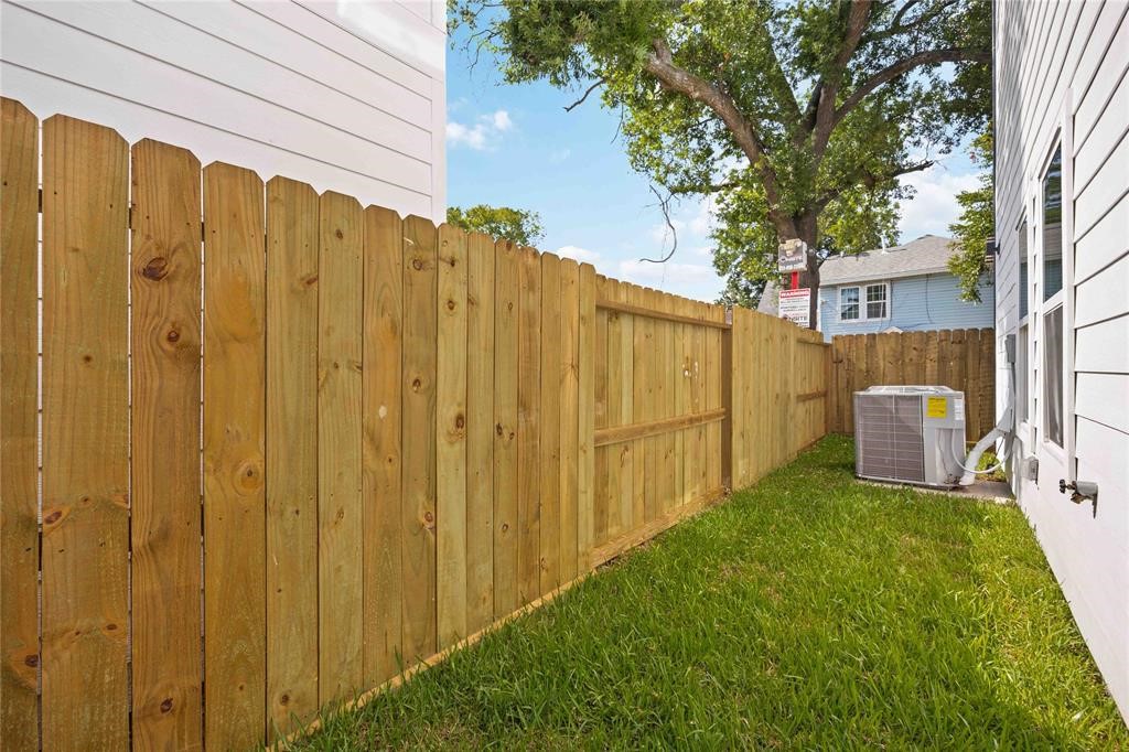 2118 Dan Street Houston, TX 77020 - Photo 10 of 35 a view of a back yard with a wooden fence