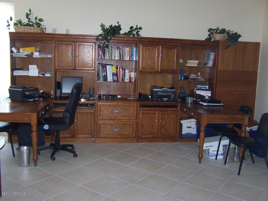 530 Ruth Lane Rio Rico, AZ 85648 - Photo 24 of 36 a kitchen with a cabinets and chairs