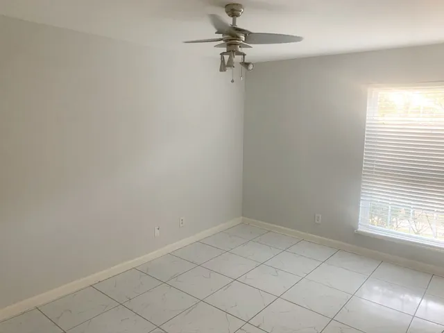 a view of a room that has a window in it