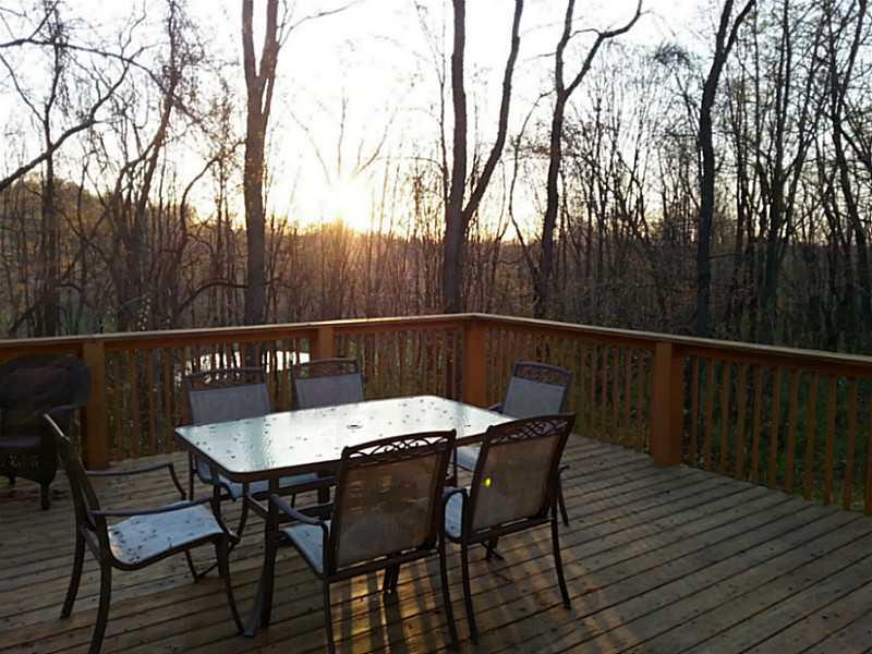 264 Steiner Bridge Road Valencia, PA 16059 - Photo 23 of 25 View. The view from the deck includes a pond and woods.
