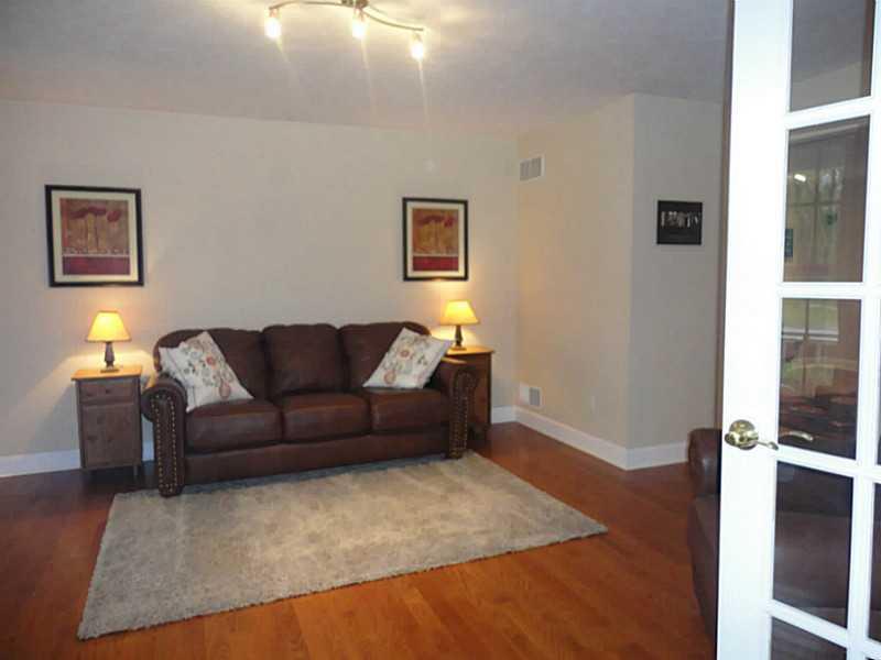 264 Steiner Bridge Road Valencia, PA 16059 - Photo 5 of 25 Living Room. This room connects to the rest of the public rooms with French doors and could be used as a formal living room or office.