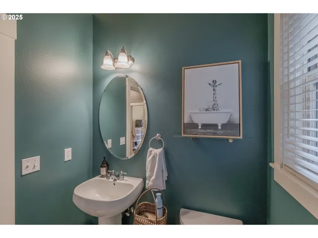 a room with a window and furniture