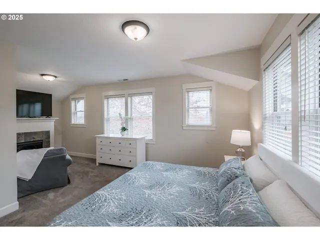 a bathroom with a sink double vanity granite tub and a mirror