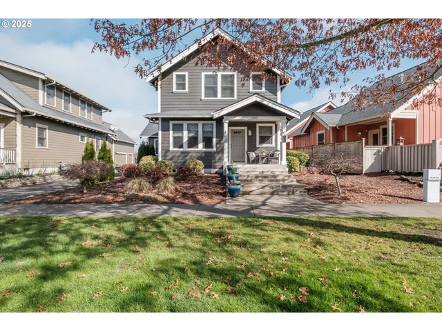 a front view of a house with a yard table and chairs