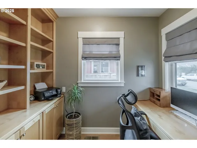 a table with a chair and window