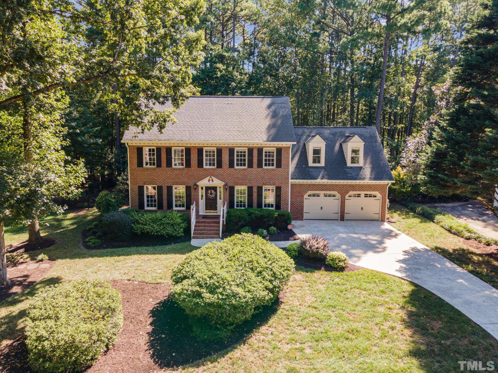 12036 Warwickshire Way Raleigh, NC 27613 - Photo 1 of 40 a front view of a house with garden