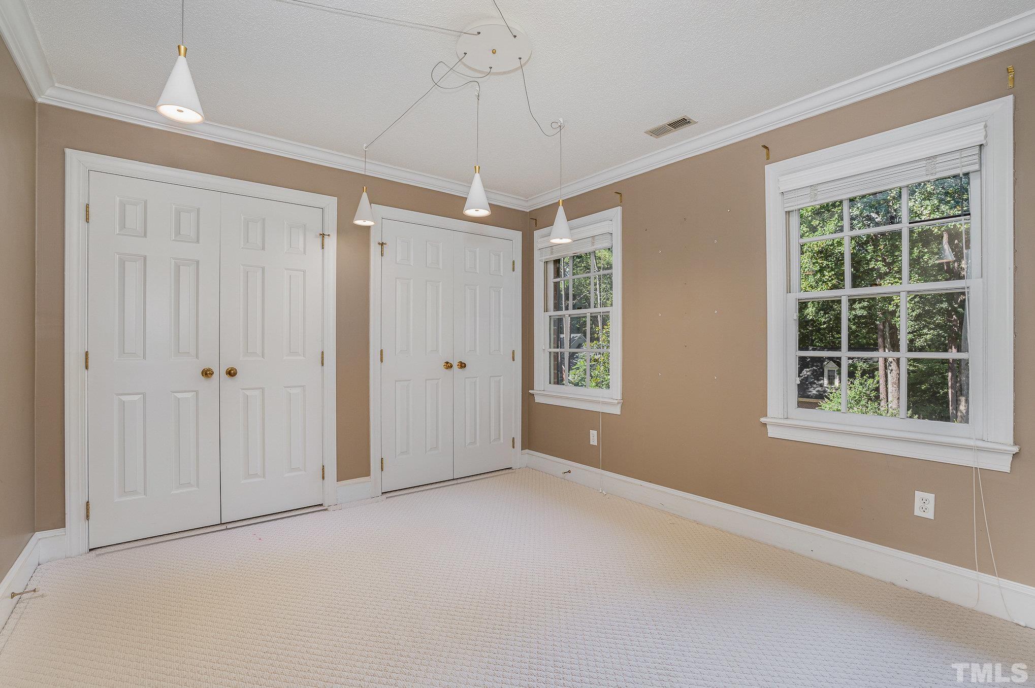 12036 Warwickshire Way Raleigh, NC 27613 - Photo 21 of 40 a view of an empty room with a window