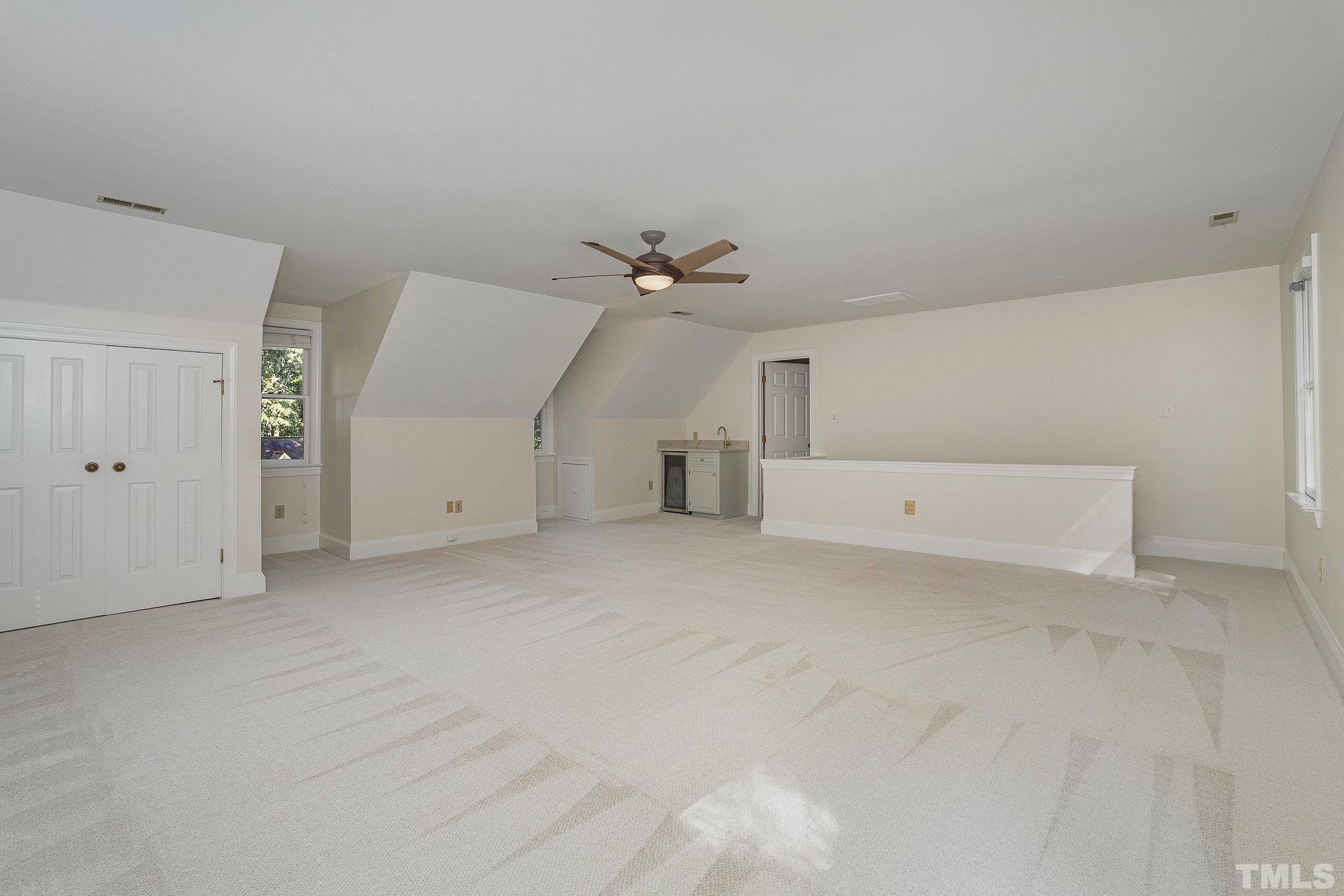 12036 Warwickshire Way Raleigh, NC 27613 - Photo 24 of 40 a view of a livingroom with a ceiling fan and window