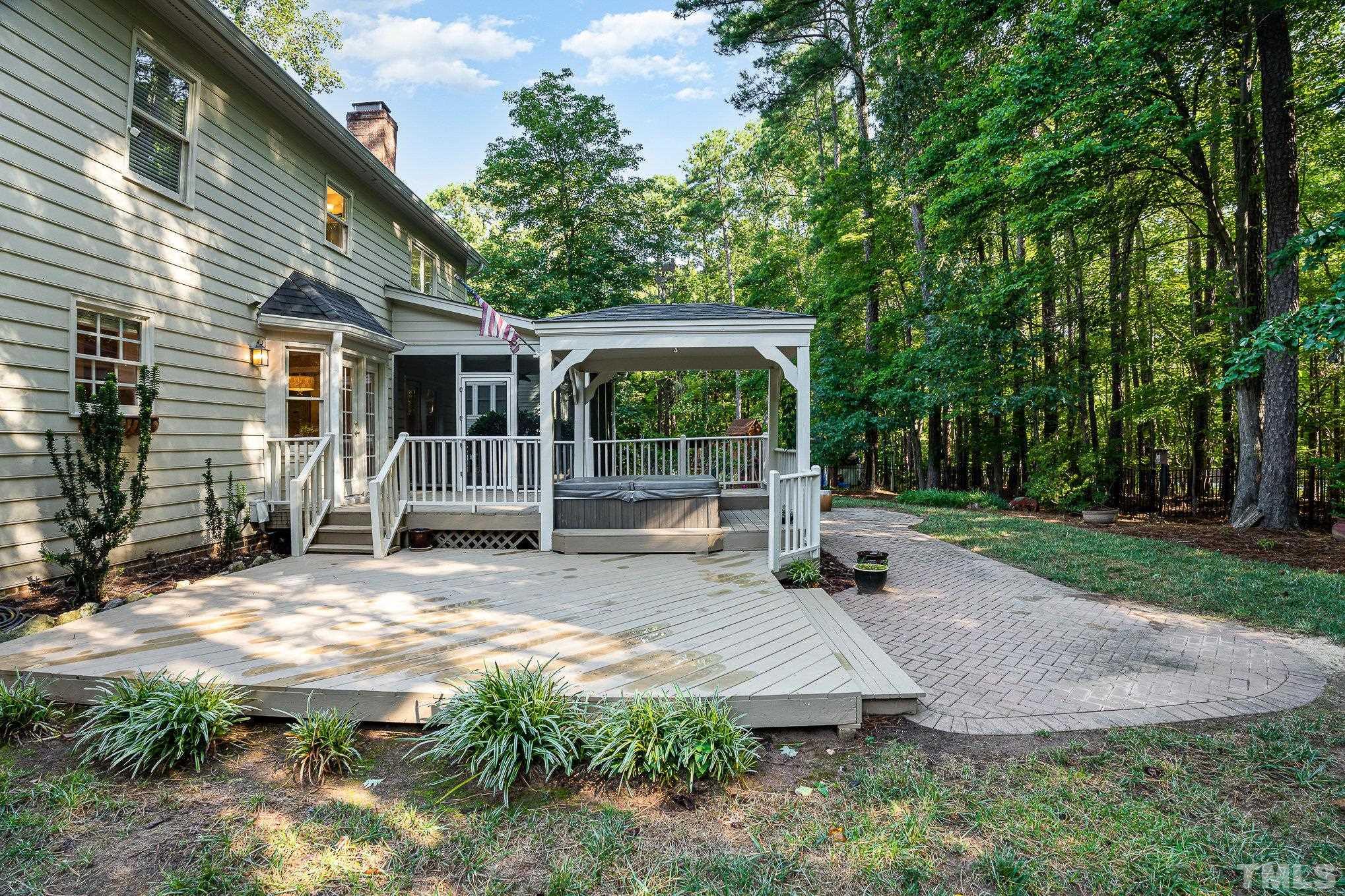 12036 Warwickshire Way Raleigh, NC 27613 - Photo 29 of 40 a view of a house with backyard and sitting area