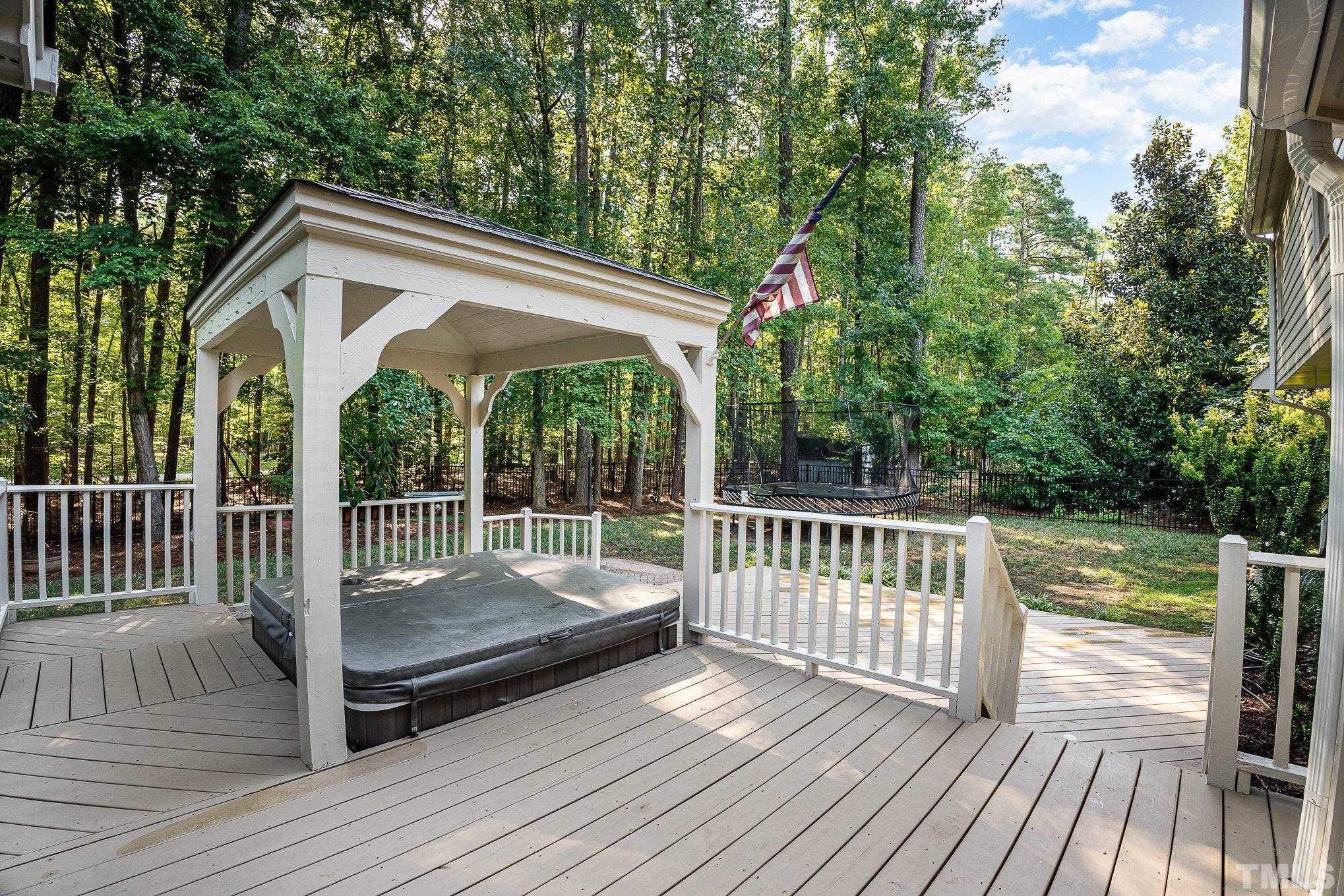 12036 Warwickshire Way Raleigh, NC 27613 - Photo 30 of 40 a view of a wooden deck and a backyard