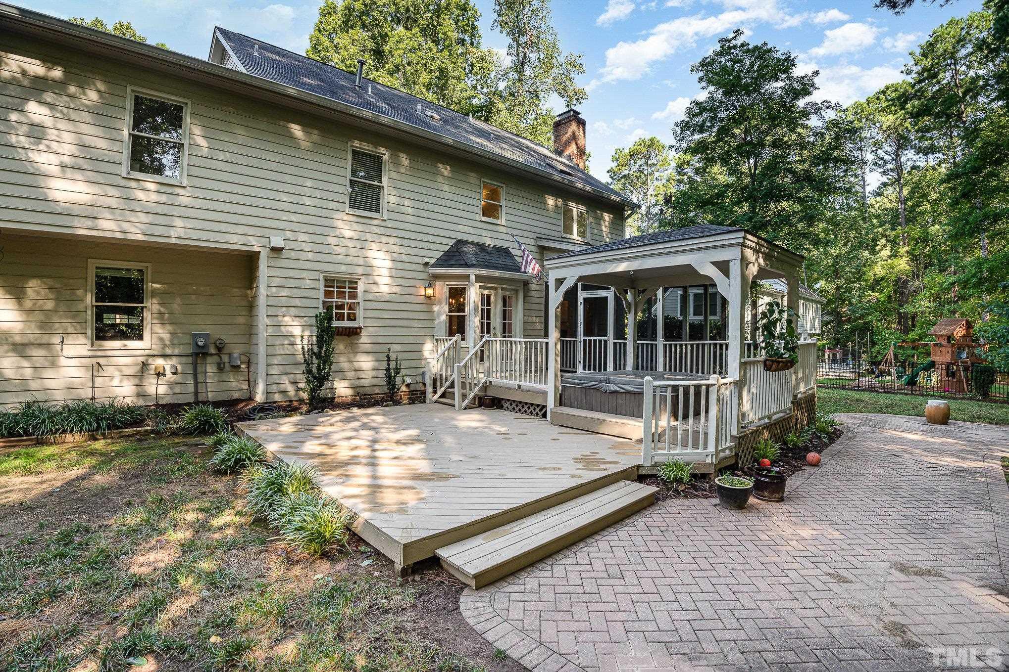 12036 Warwickshire Way Raleigh, NC 27613 - Photo 31 of 40 a view of a house with backyard and sitting area