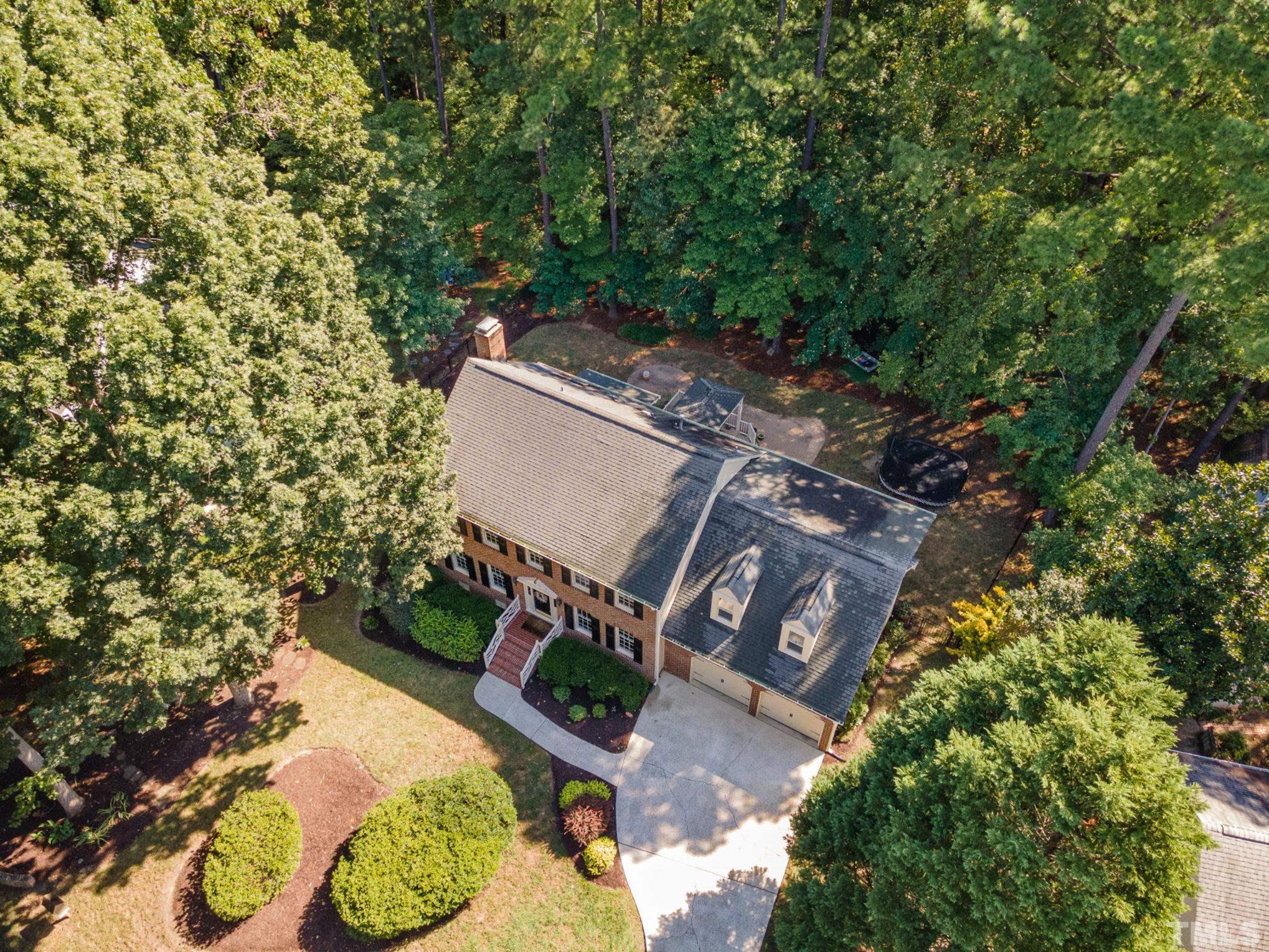 12036 Warwickshire Way Raleigh, NC 27613 - Photo 32 of 40 an aerial view of a house with a yard and garden