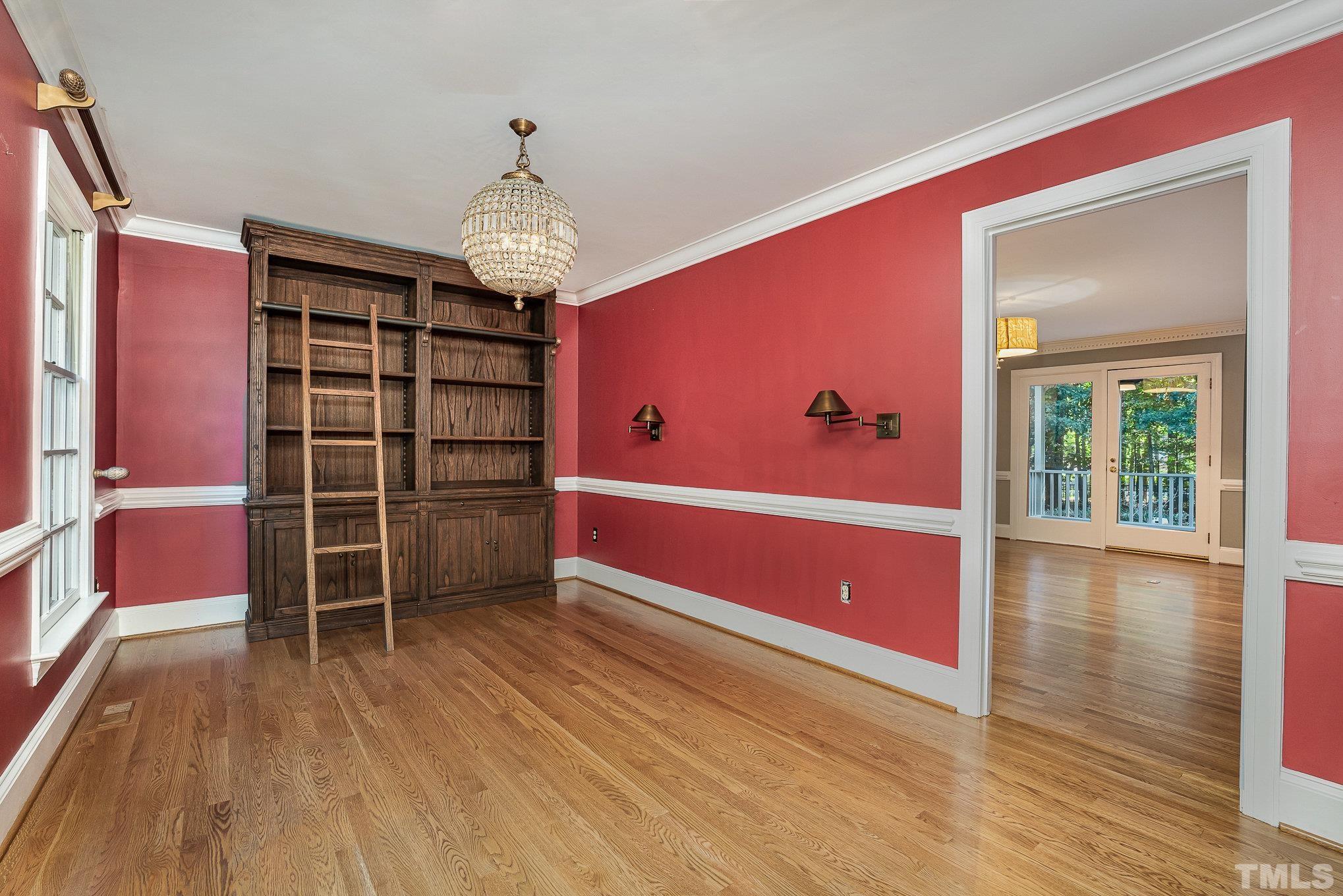 12036 Warwickshire Way Raleigh, NC 27613 - Photo 10 of 40 a view of a livingroom with furniture and wooden floor