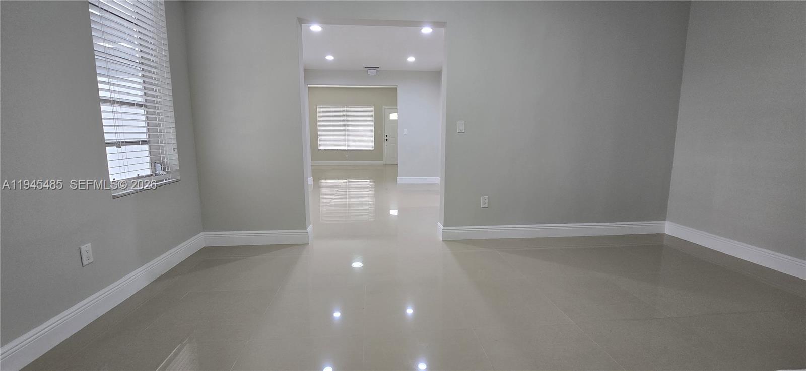 75 Southwest 32nd Court Road Miami, FL 33135 - Photo 12 of 53 an empty room with windows and closet