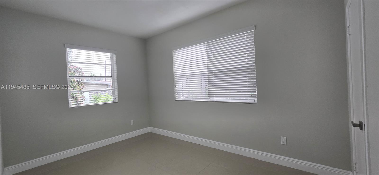 75 Southwest 32nd Court Road Miami, FL 33135 - Photo 15 of 53 an empty room with a window