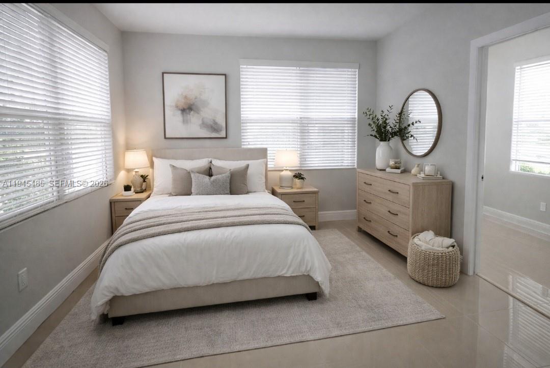 75 Southwest 32nd Court Road Miami, FL 33135 - Photo 19 of 53 a bedroom with bed and a window