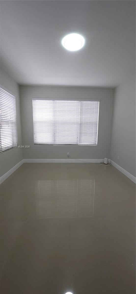 75 Southwest 32nd Court Road Miami, FL 33135 - Photo 21 of 53 an empty room with a window
