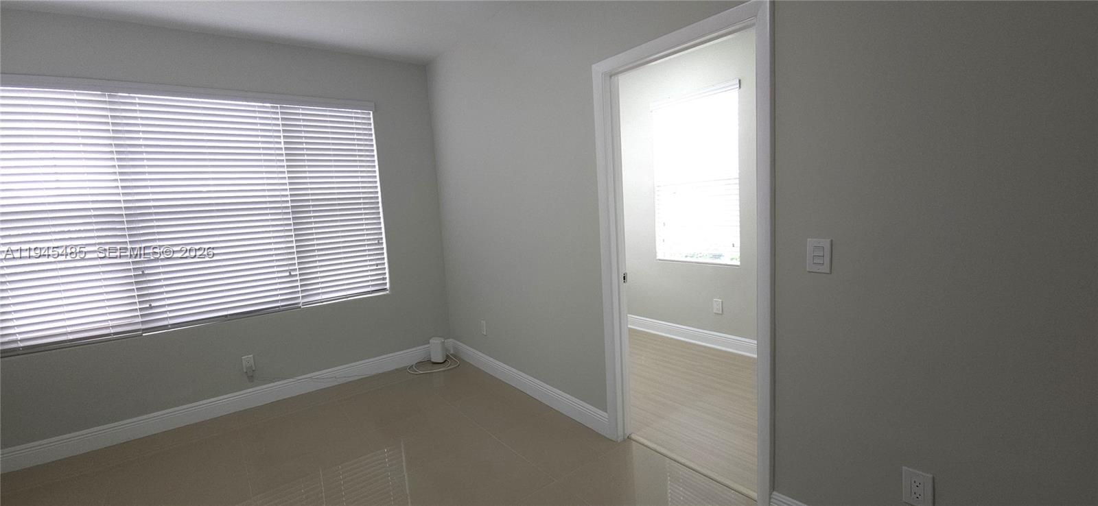 75 Southwest 32nd Court Road Miami, FL 33135 - Photo 22 of 53 a view of an empty room with a window