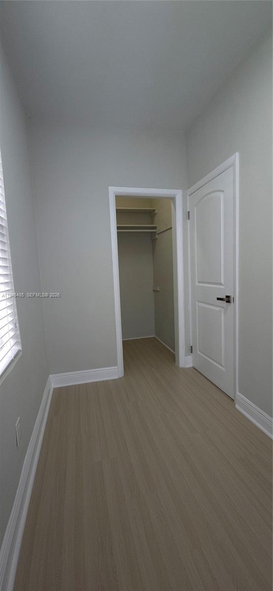75 Southwest 32nd Court Road Miami, FL 33135 - Photo 23 of 53 an empty room with closet and a window