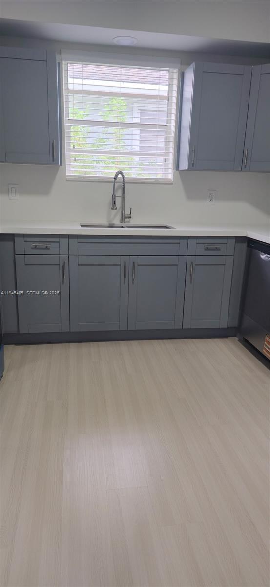 75 Southwest 32nd Court Road Miami, FL 33135 - Photo 29 of 53 a kitchen with cabinets and window