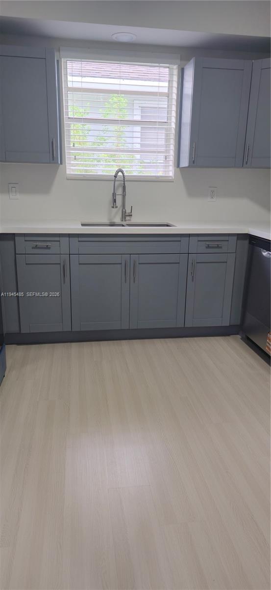 75 Southwest 32nd Court Road Miami, FL 33135 - Photo 30 of 53 a view of kitchen with kitchen island a sink a refrigerator and window