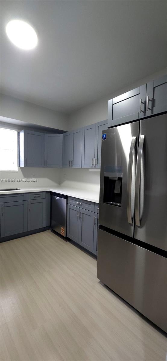 75 Southwest 32nd Court Road Miami, FL 33135 - Photo 32 of 53 a kitchen with stainless steel appliances a refrigerator and a sink