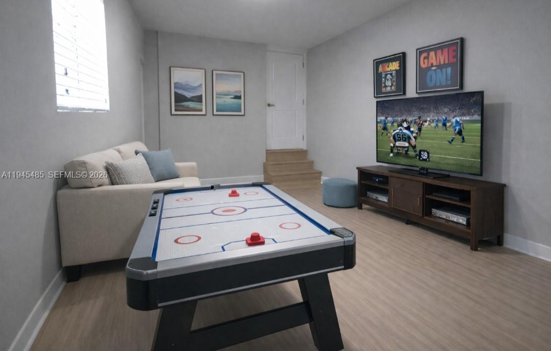 75 Southwest 32nd Court Road Miami, FL 33135 - Photo 35 of 53 a living room with furniture and a flat screen tv