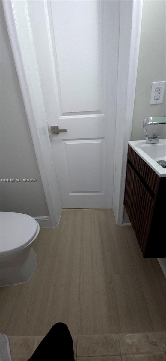 75 Southwest 32nd Court Road Miami, FL 33135 - Photo 41 of 53 a bathroom with a sink and a toilet