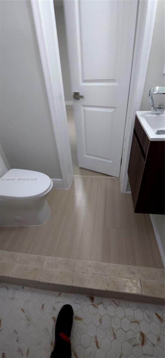 75 Southwest 32nd Court Road Miami, FL 33135 - Photo 43 of 53 a bathroom with a sink and a toilet