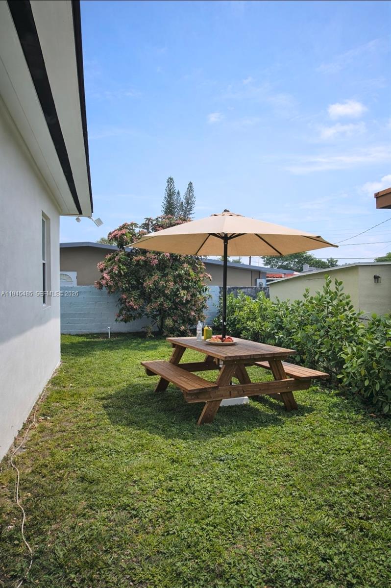 75 Southwest 32nd Court Road Miami, FL 33135 - Photo 49 of 53 a view of swimming pool with outdoor seating and plants
