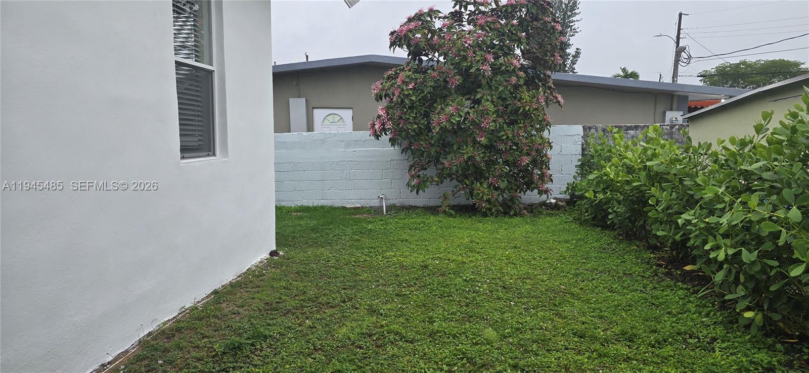 75 Southwest 32nd Court Road Miami, FL 33135 - Photo 50 of 53 a view of a house with a yard