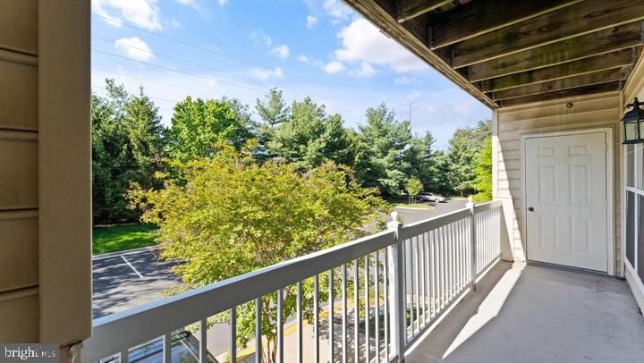 1918 Crescent Park Drive Reston, VA 20190 - Photo 18 of 33 Serene balcony with lush greenery views.