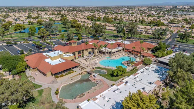an aerial view of residential houses with outdoor space