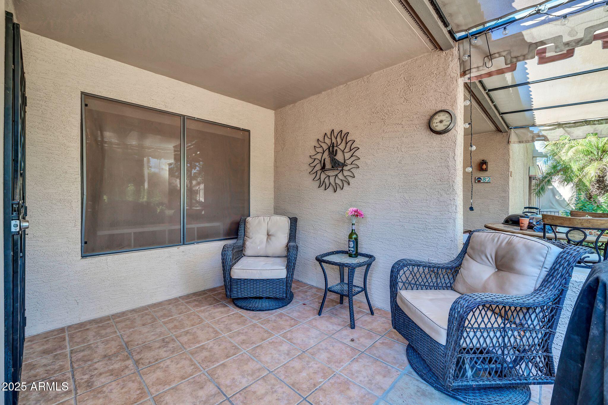14300 West Bell Road, Unit 83 Surprise, AZ 85374 - Photo 3 of 22 a living room with furniture and a window