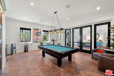 a room with furniture and pool table
