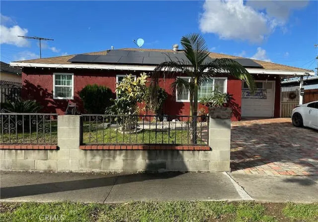 a view of a house with large windows