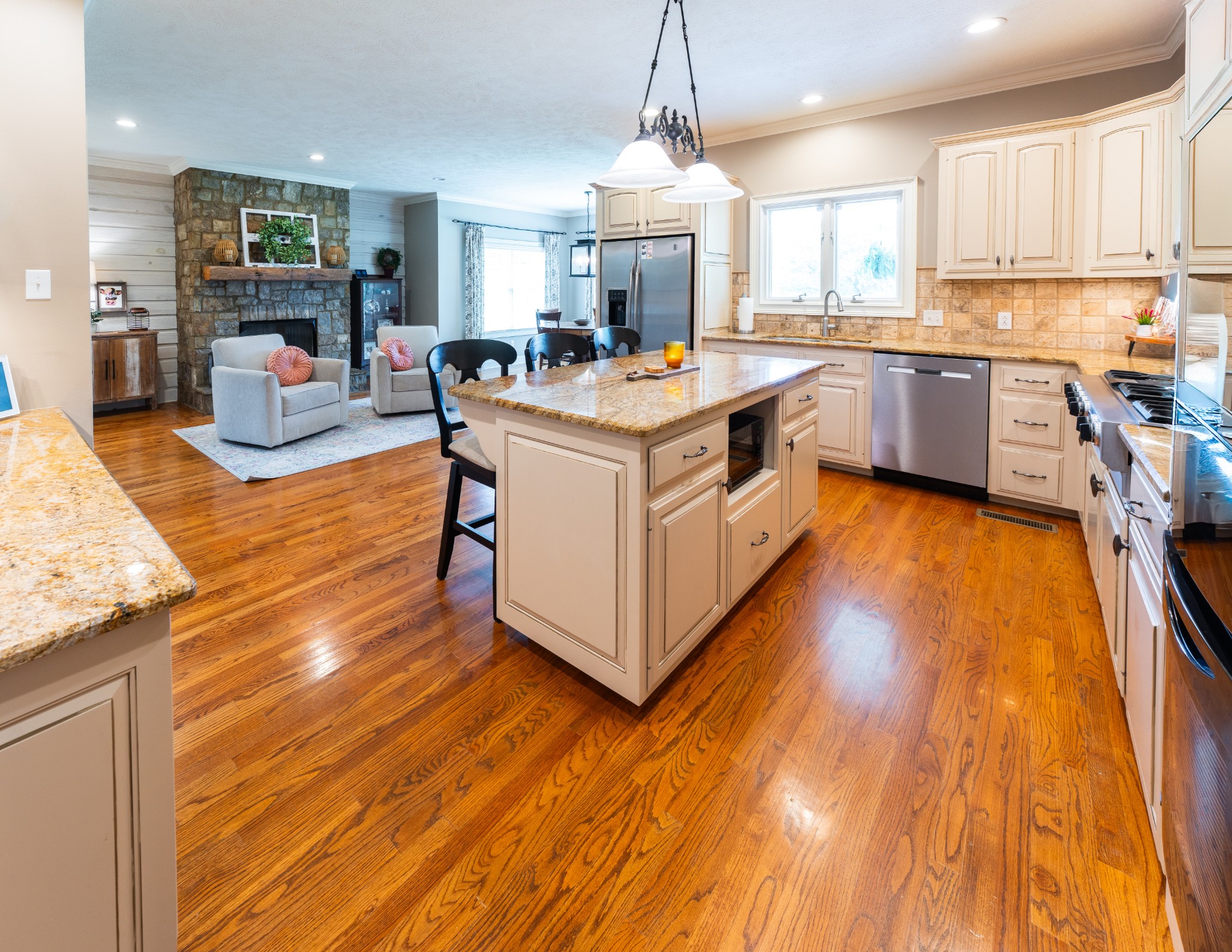 1015 Kelly Road Dyersburg, TN 38024 - Photo 16 of 41 a large kitchen with stainless steel appliances granite countertop a stove and a wooden floors