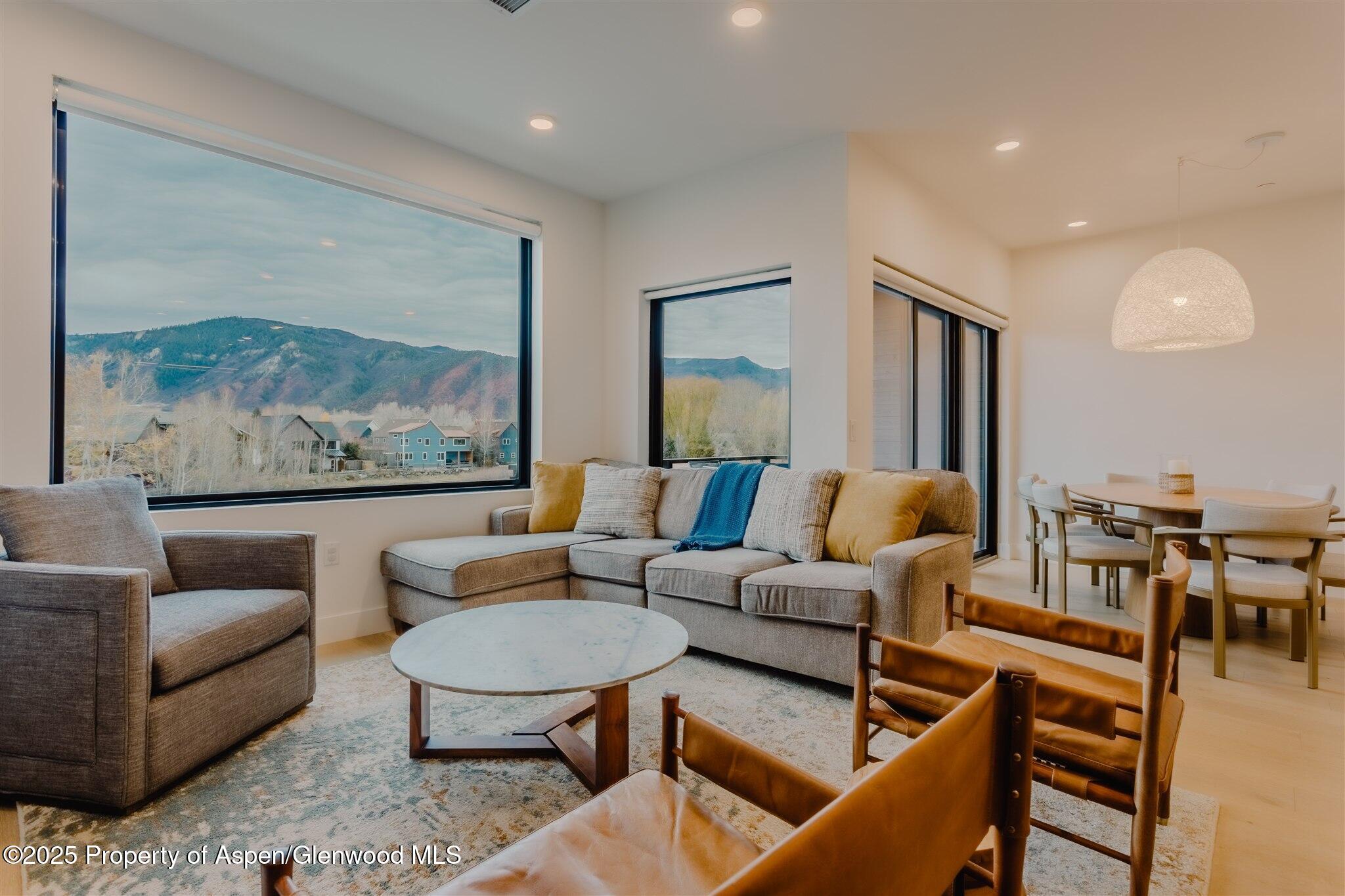 220 Lewis Lane Basalt, CO 81621 - Photo 18 of 62 a living room with furniture and a painting on the wall