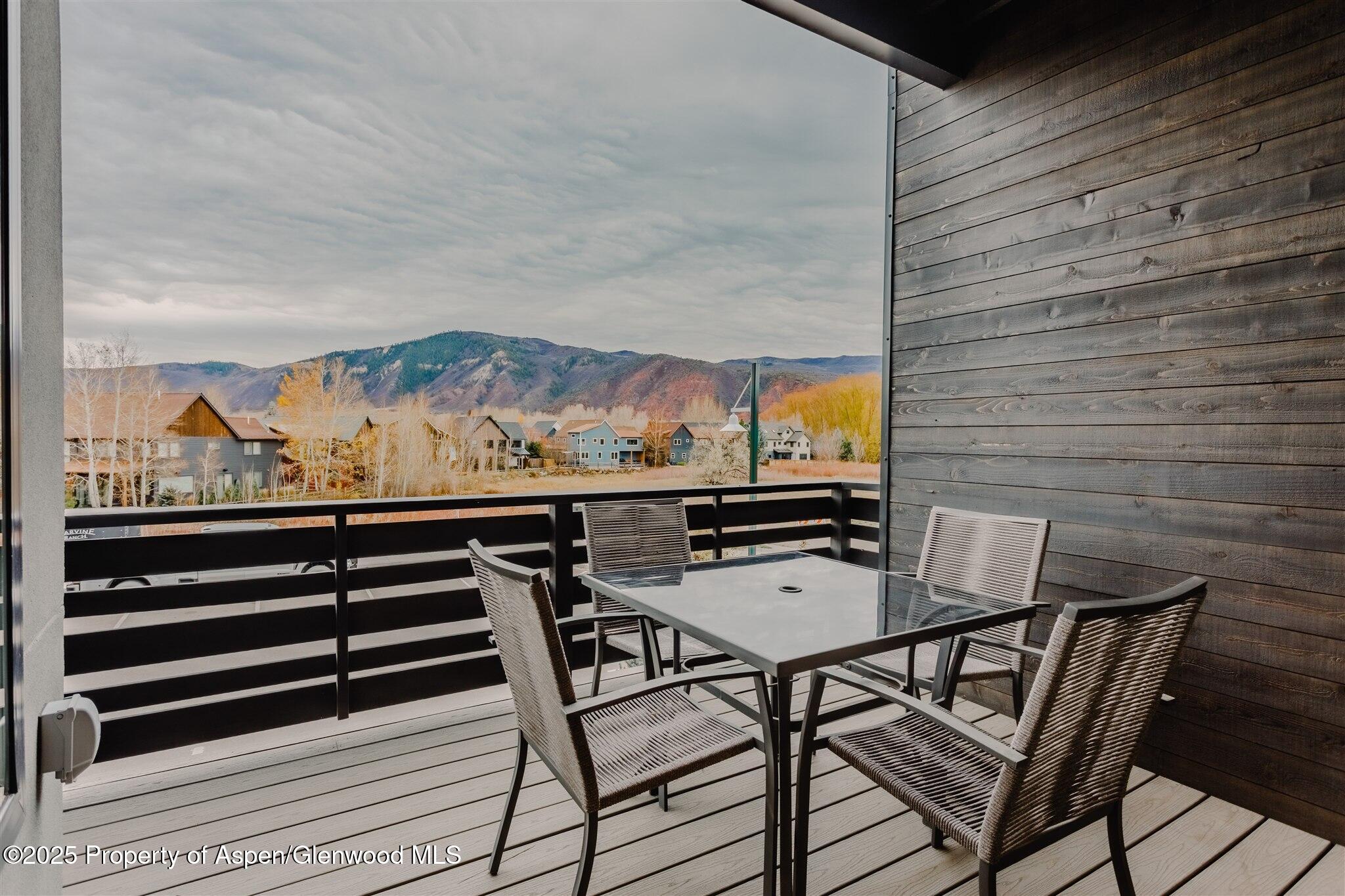 220 Lewis Lane Basalt, CO 81621 - Photo 23 of 62 a view of a balcony with furniture and wooden floor