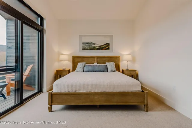 a balcony with table and chairs